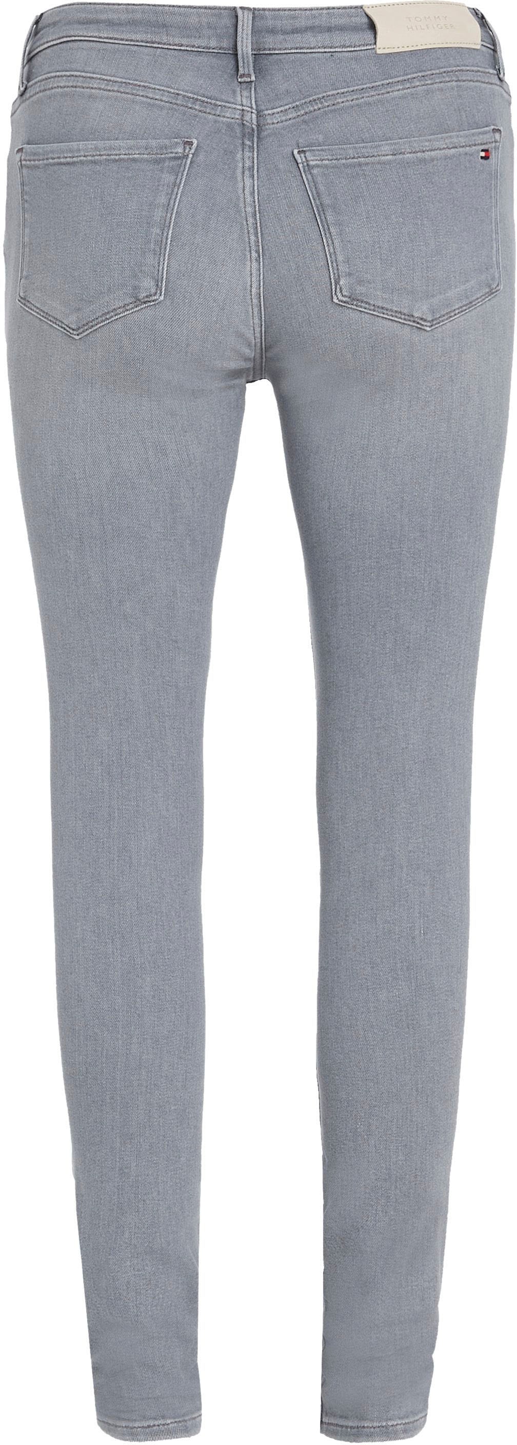 Tommy COMO BAUR SKINNY mit Brand-Features IZZU«, RW Tommy FLEX online | Hilfiger »TH Hilfiger kaufen Skinny-fit-Jeans vielen