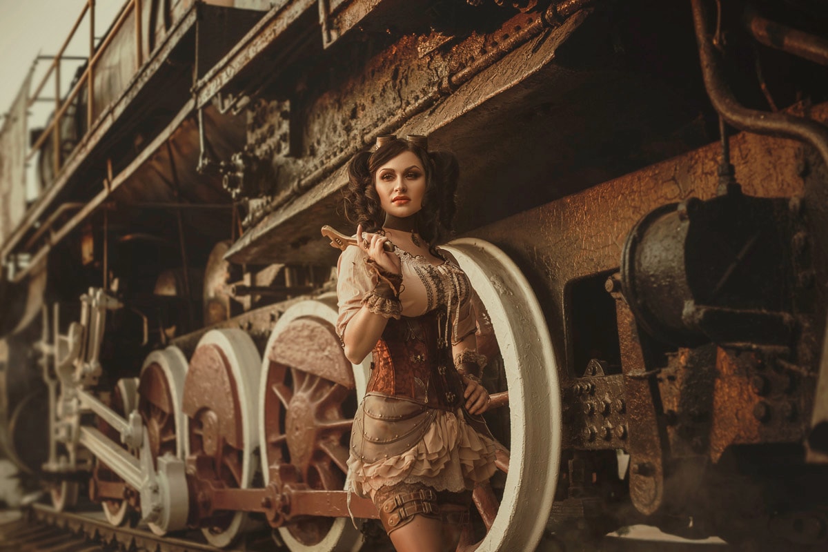 Fototapete »Steampunk Frau vor Zug«