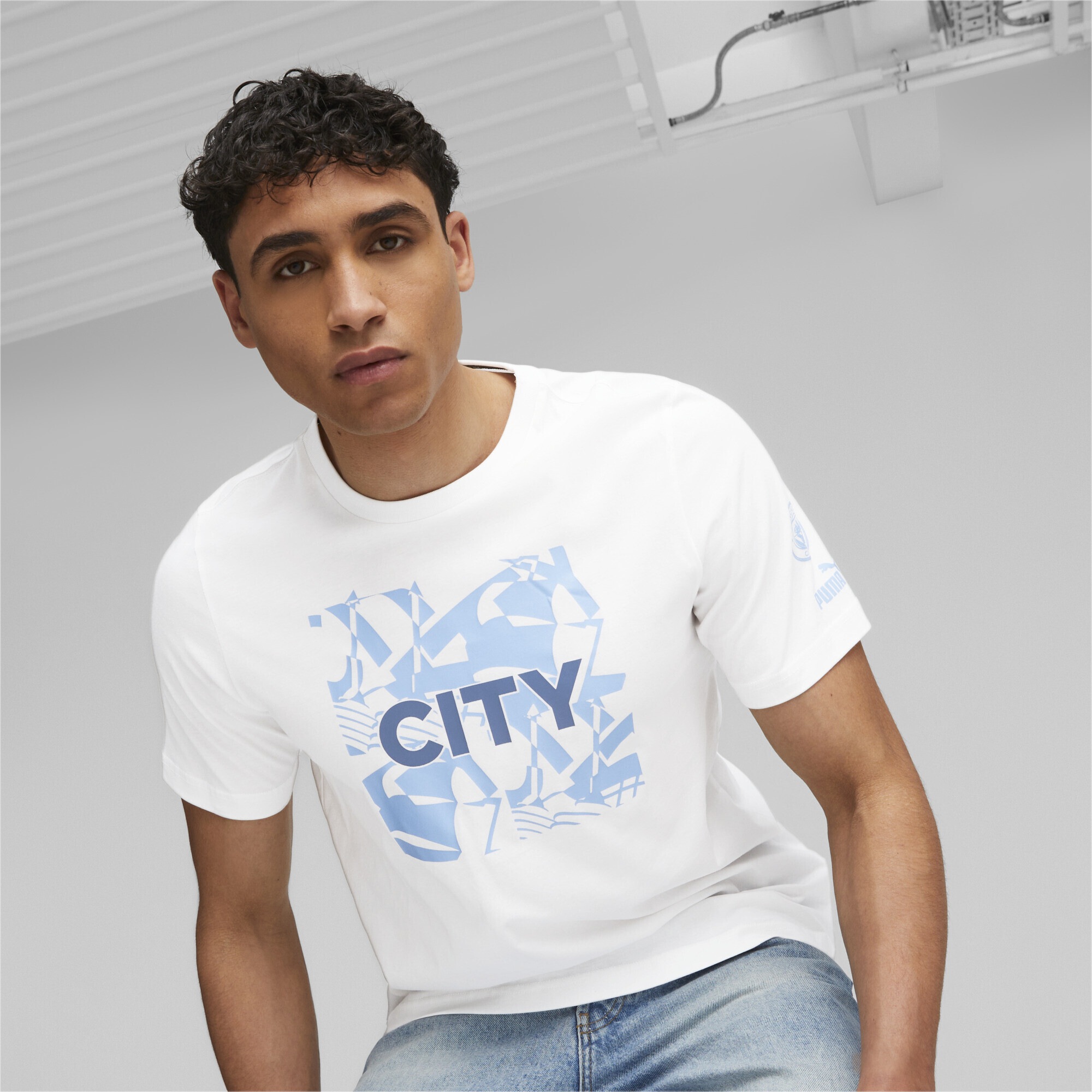 PUMA T-Shirt »Manchester City FtblCore Graphic T-Shirt Herren«
