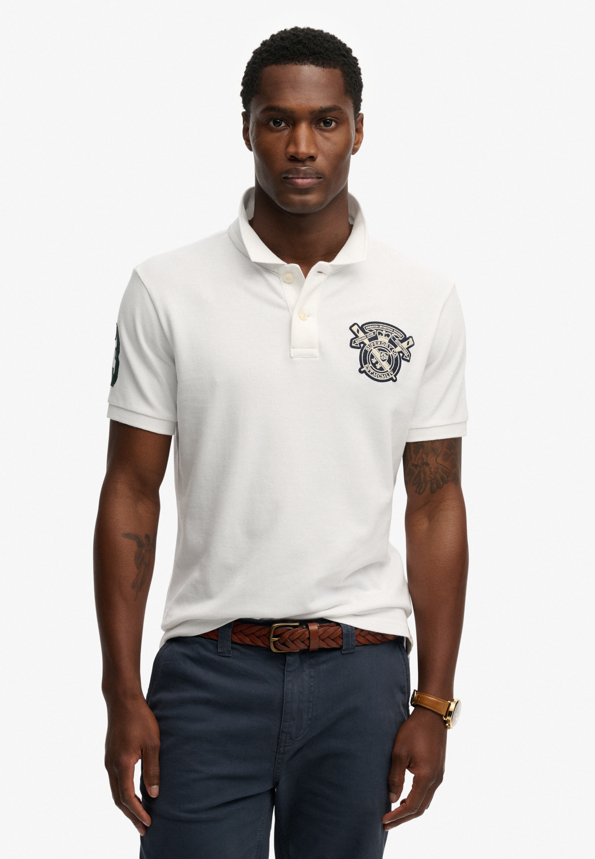 Superdry Poloshirt "CREST POLO" mit Markenlabel, aus Baumwolle, Relaxed Fit, bedruckte Optik