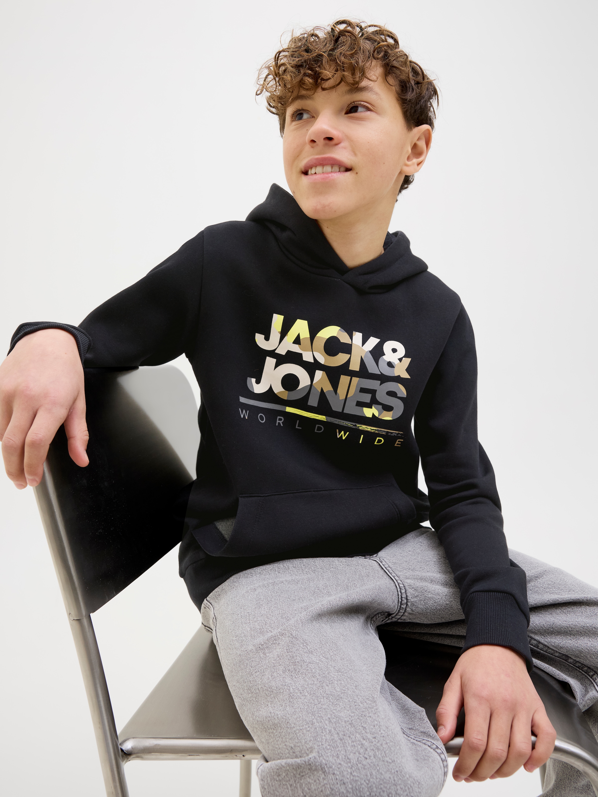 Jack & Jones Junior Hoodie »JJLUKE SWEAT HOOD JNR«, mit coolem Logo-Frontmotiv