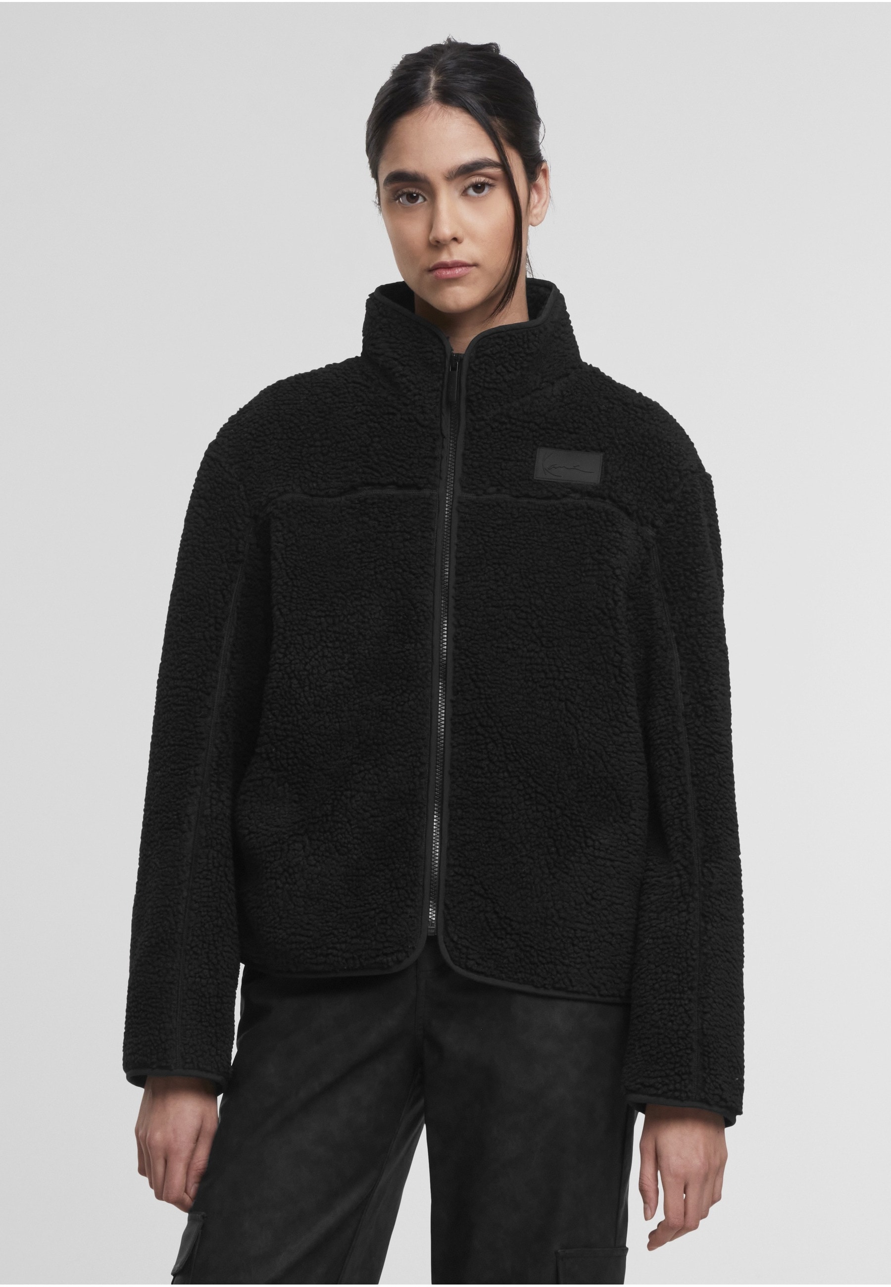 Karl Kani Trainingsjacke »Karl Kani Signature Teddy Trackjacket« 1 Stk. tlg. ohne Kapuze