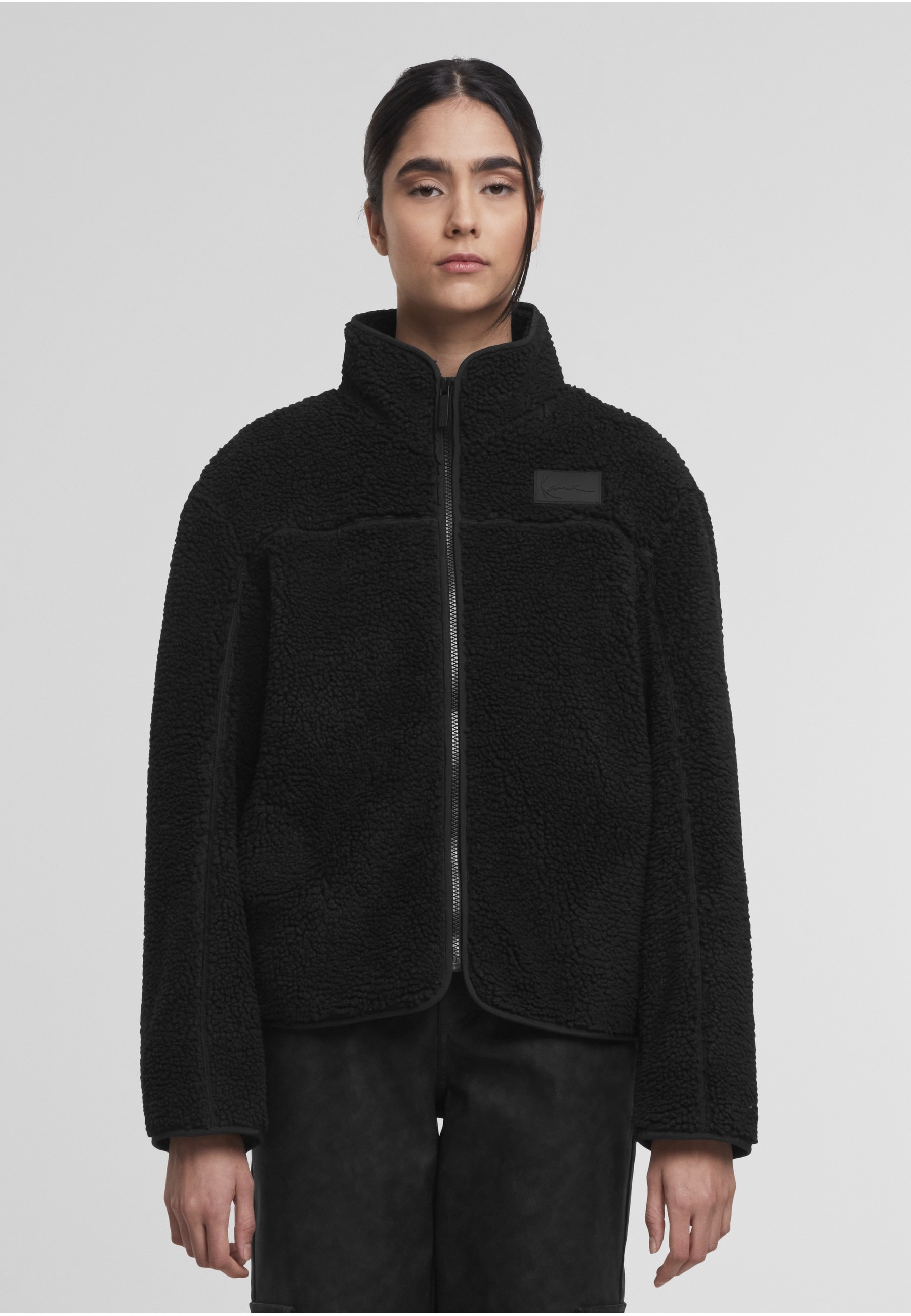 Karl Kani Trainingsjacke »Karl Kani Signature Teddy Trackjacket« 1 Stk. tlg. ohne Kapuze