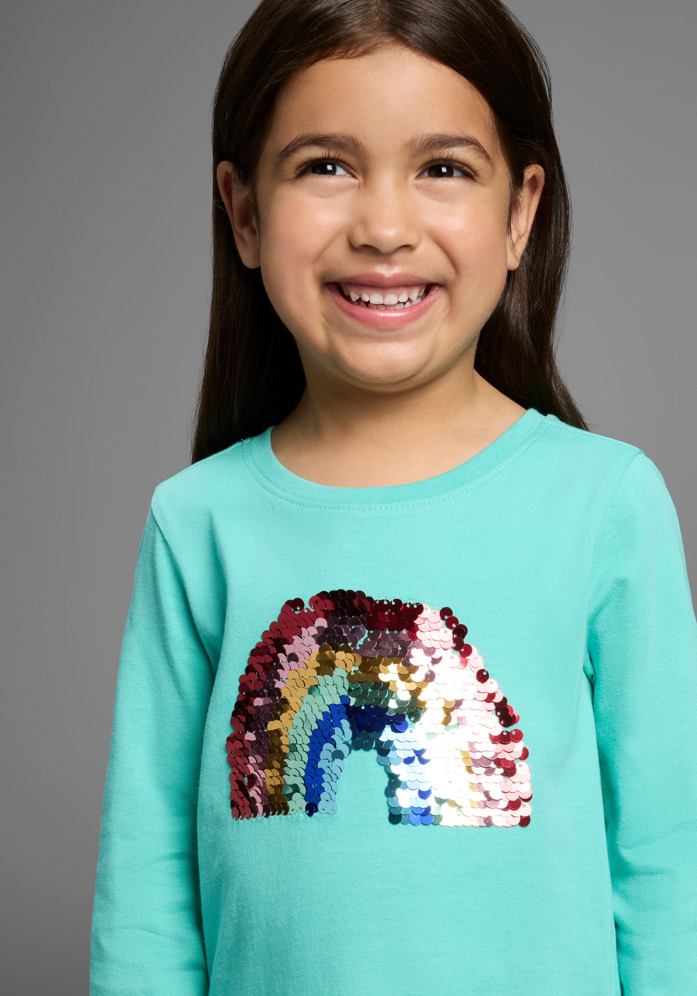 Thumbnail - KIDSWORLD Langarmshirt "Regenbogen Pailletten-Applikation" Langarm, Basic-Passform, mit schimmernden Pailletten-Applikat...