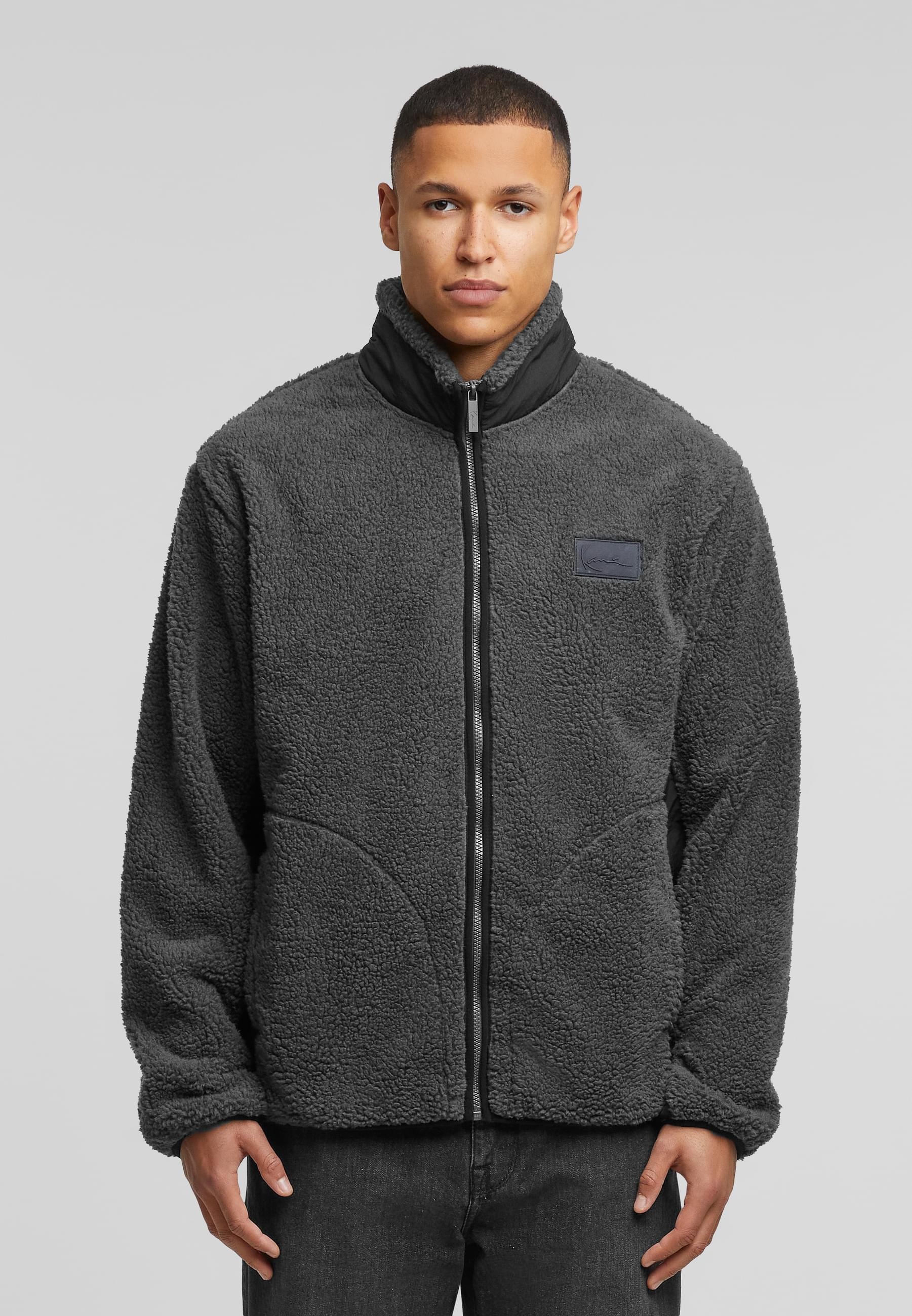 Karl Kani Allwetterjacke »Karl Kani Karl Kani Sport Patch Teddy Jacket«, (1 St.), mit Kapuze