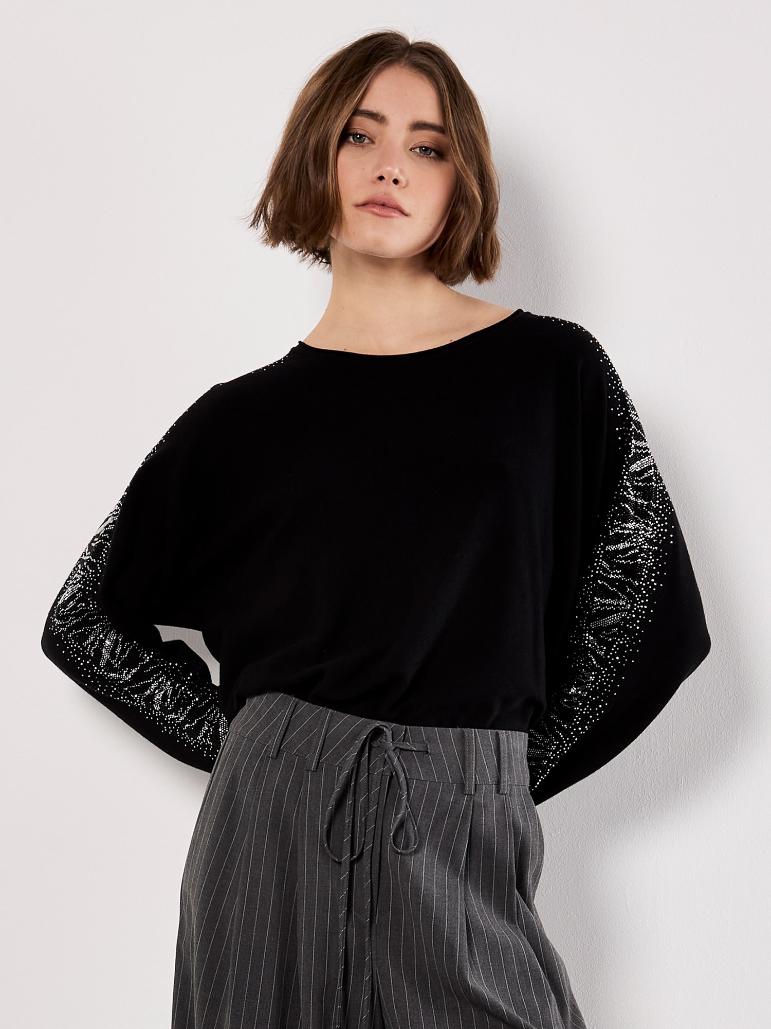 Apricot Strickpullover "Fledermauspullver" mit Verzierung im Schlangenmuster