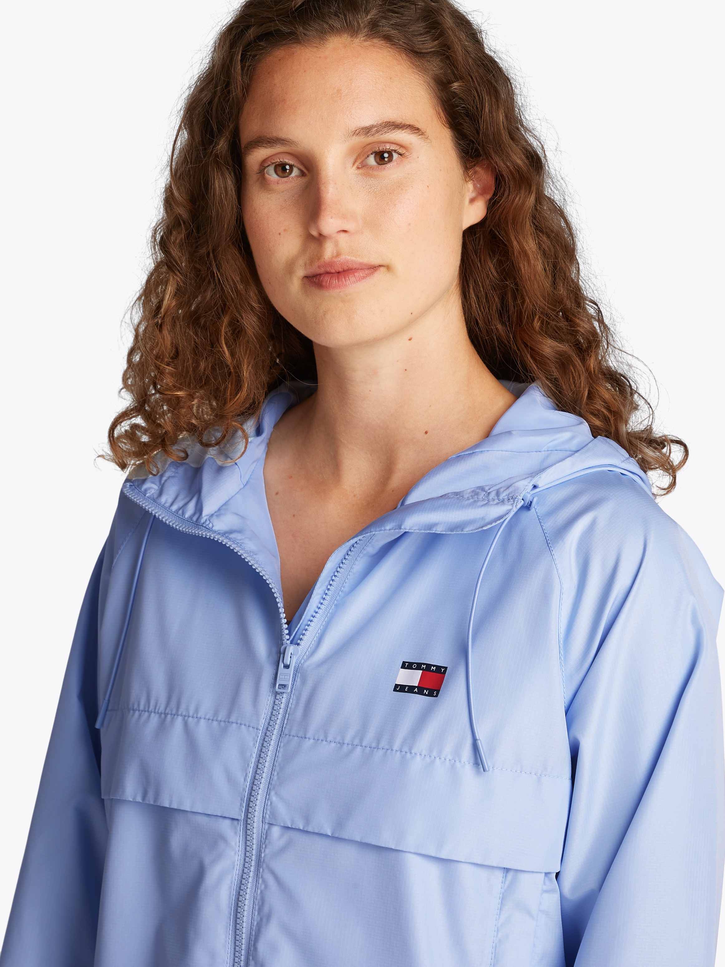 Tommy Jeans Windbreaker "TJW ESSENTIAL WINDBREAKER EXT", mit Kapuze, mit Lo günstig online kaufen