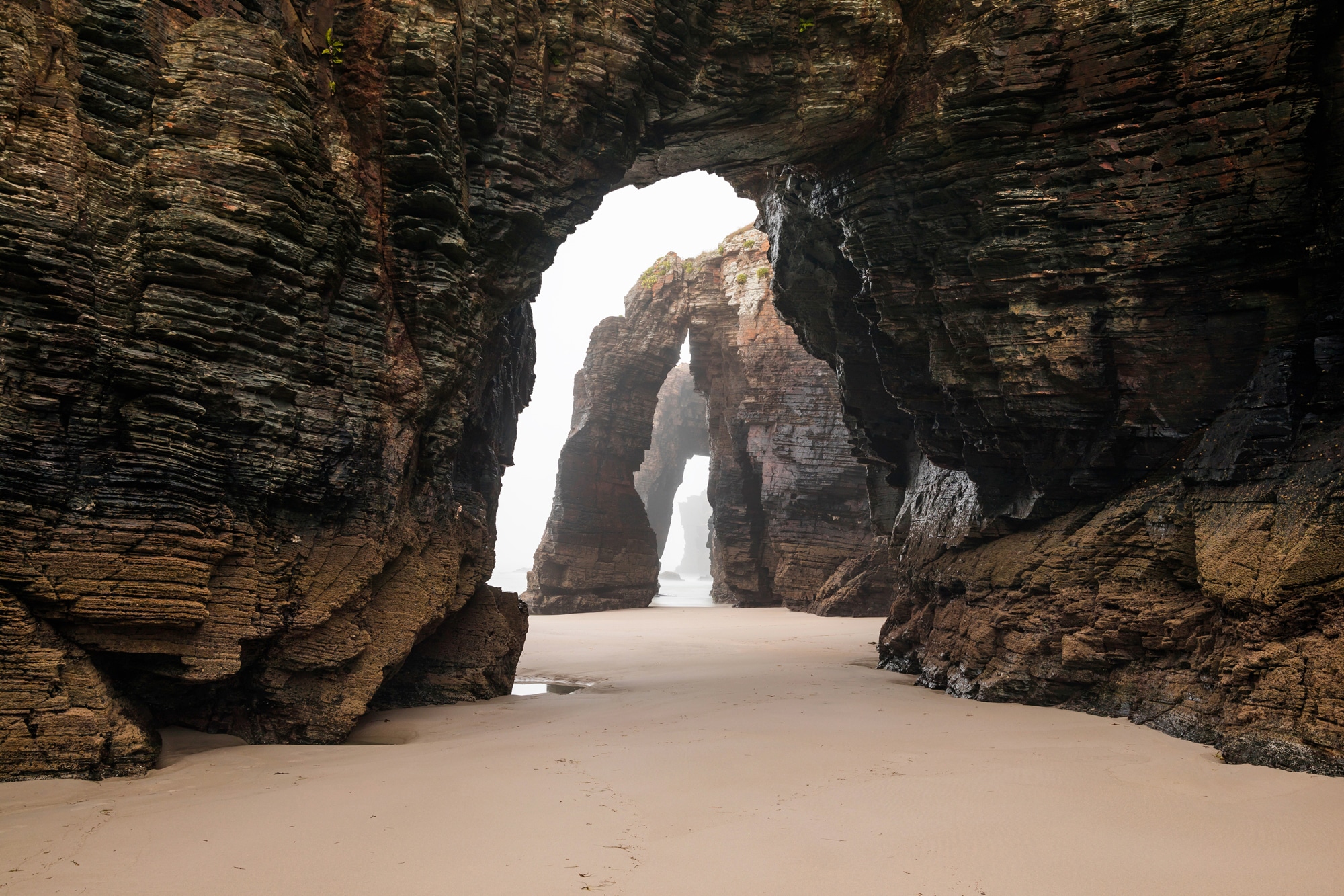 Papermoon Fototapete "GROTTE-FELSEN EBBE SPANIEN TUNNEL STRAND DUNEN MEER"