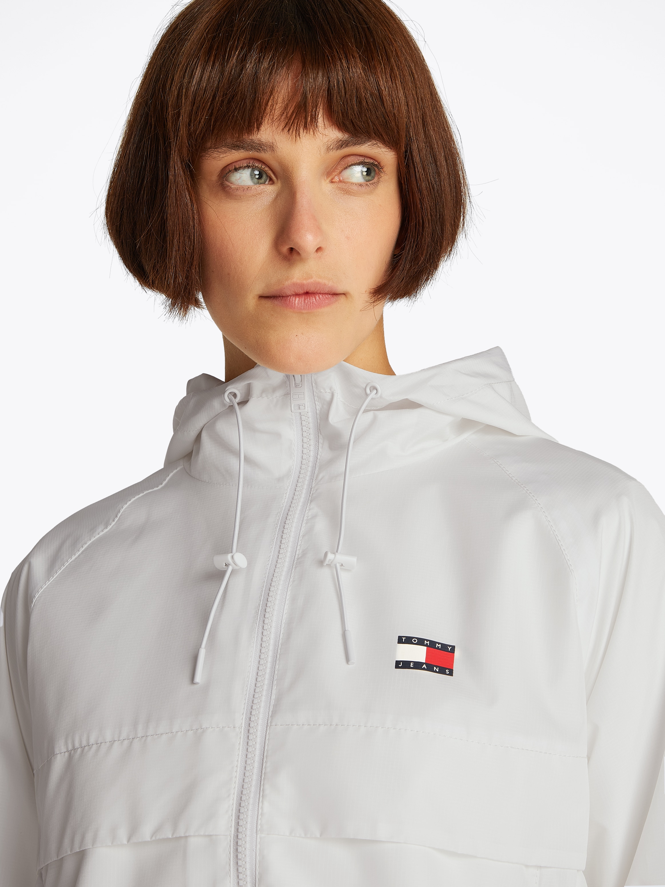 Tommy Jeans Windbreaker »TJW ESSENTIAL WINDBREAKER EXT«, mit Kapuze, mit Logodruck