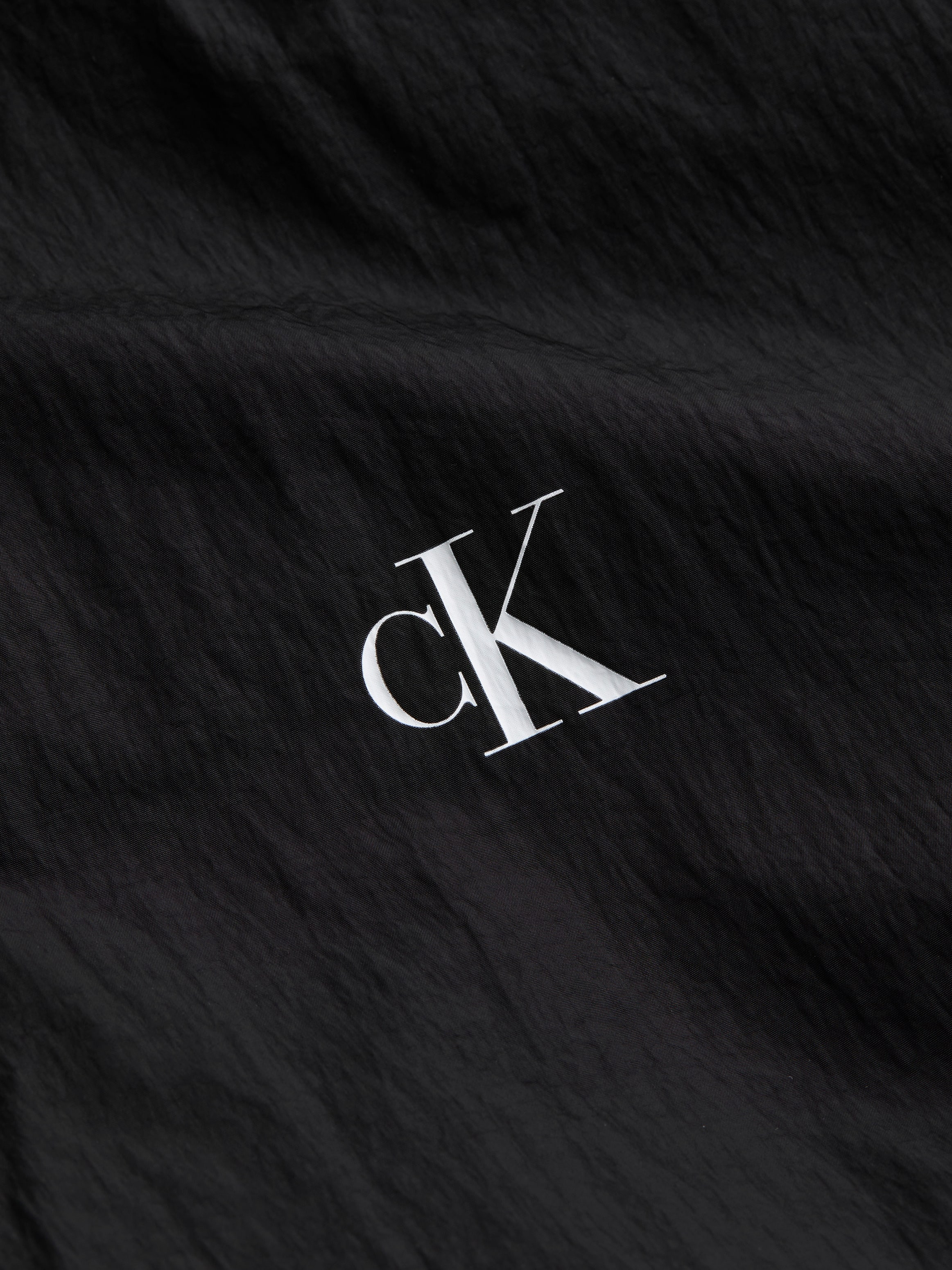 Calvin Klein Jeans Windbreaker »NYLON HOODED WINDBREAKER«, mit Kapuze, mit Logodruck