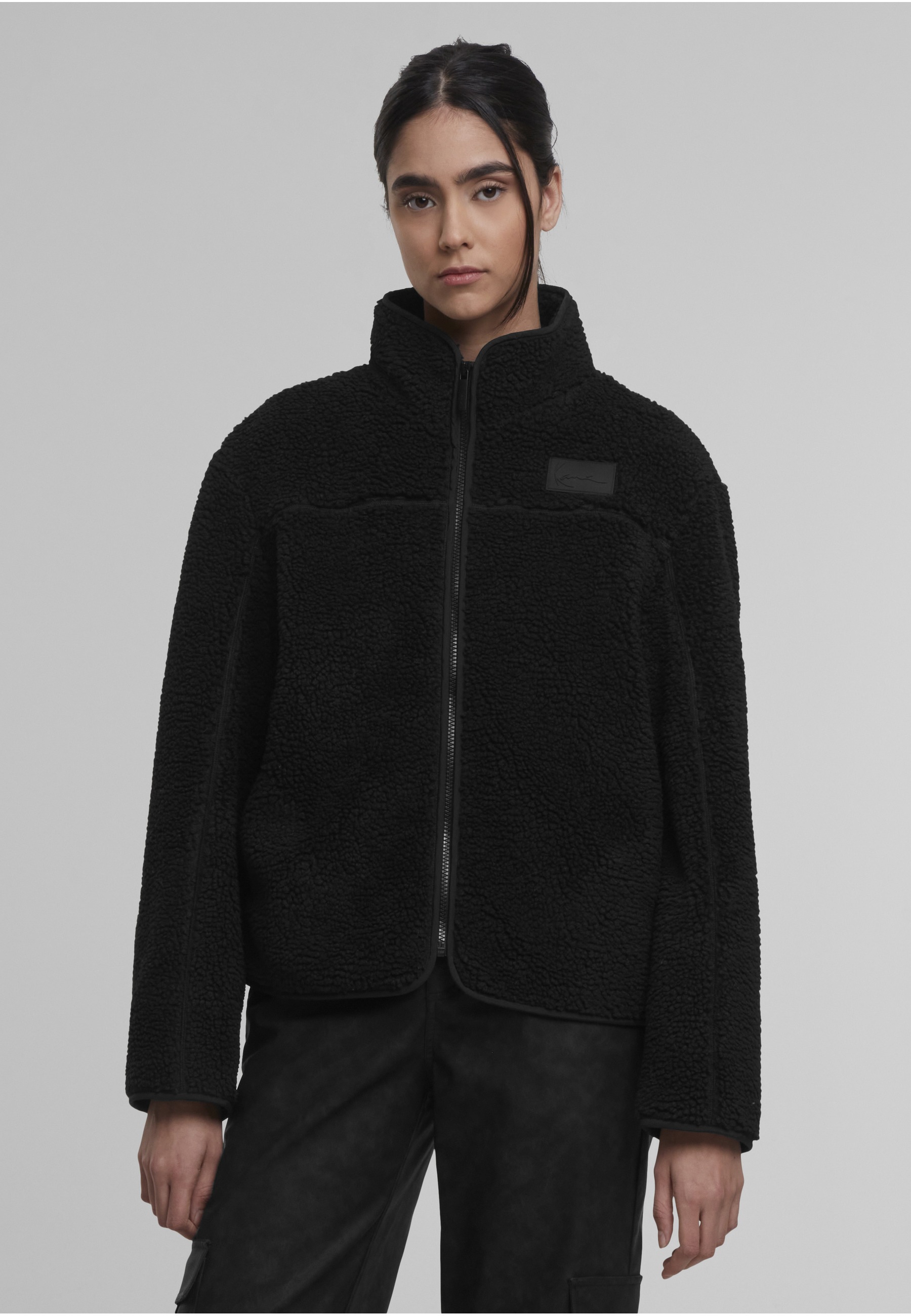 Karl Kani Trainingsjacke »Karl Kani Signature Teddy Trackjacket« 1 Stk. tlg. ohne Kapuze