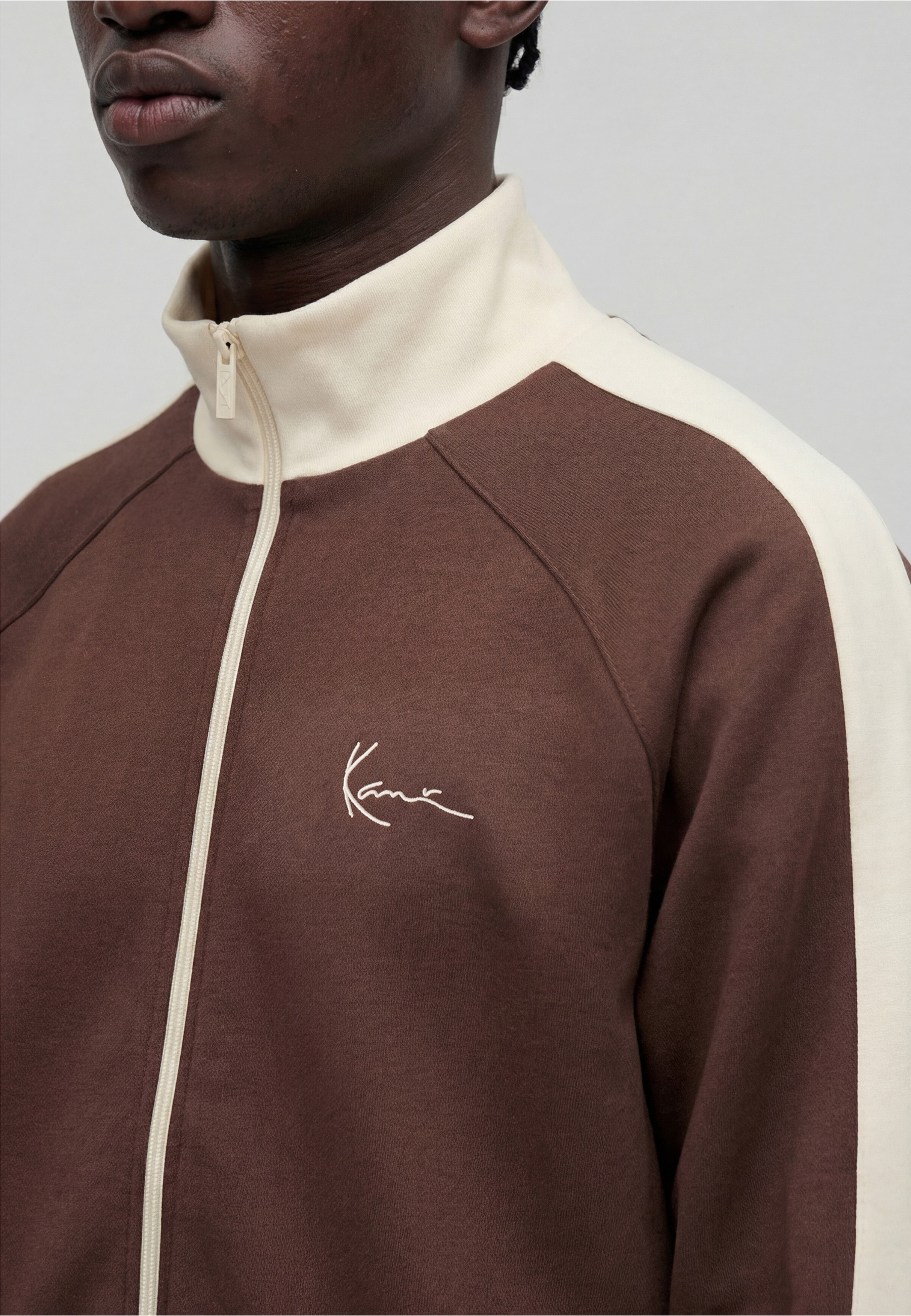 Karl Kani Outdoorjacke »Karl Kani Signature Sidestripe Pique Trackjacket« 1 Stk. tlg. ohne Kapuze